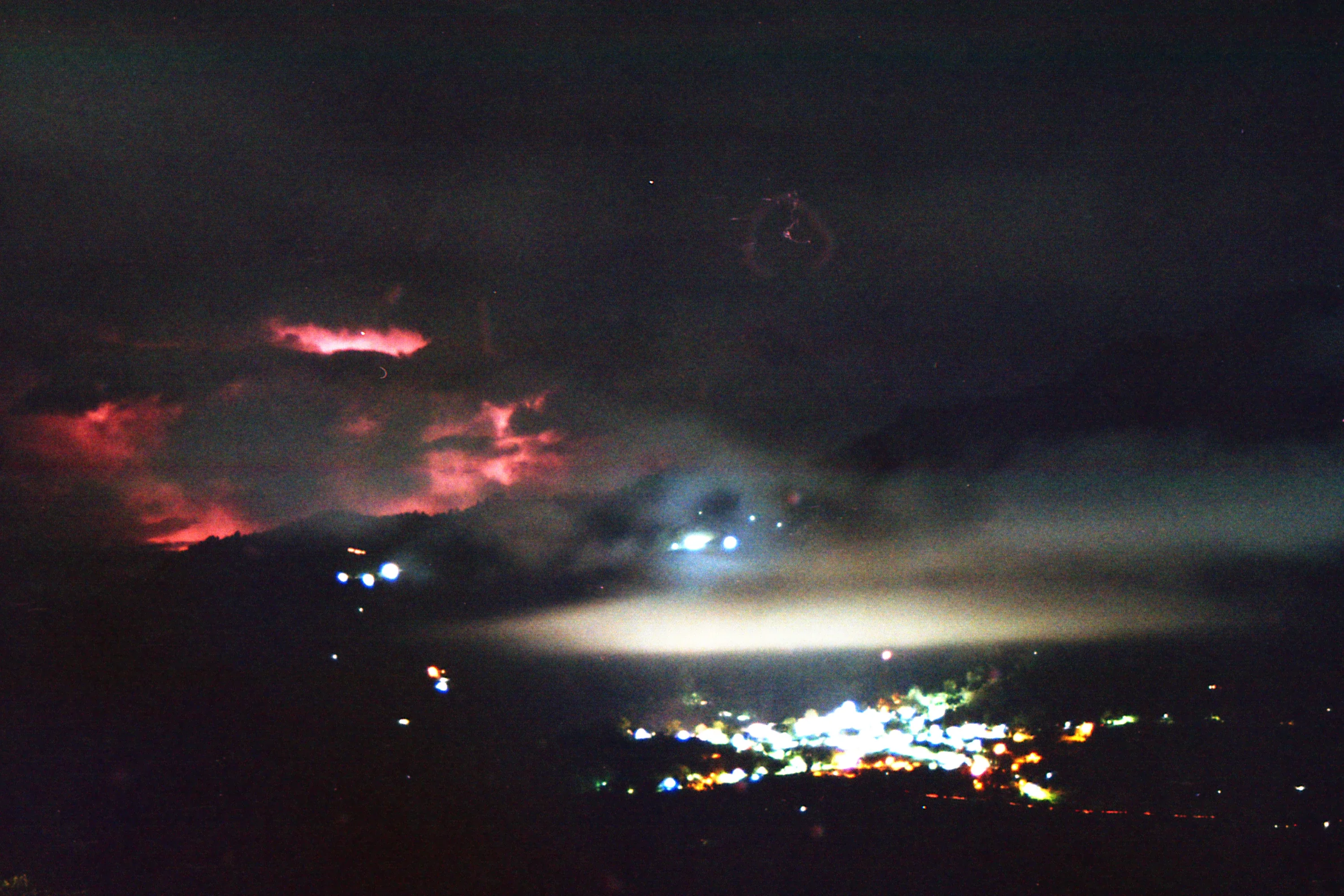 Long exposure in a night of faraway thunders. Heaven knows why is that light red, all I saw was blue flashes